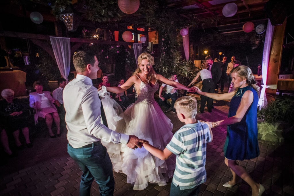 wedding guests are dancing with the bride at Nagyvillám Restaurant. Visegrád