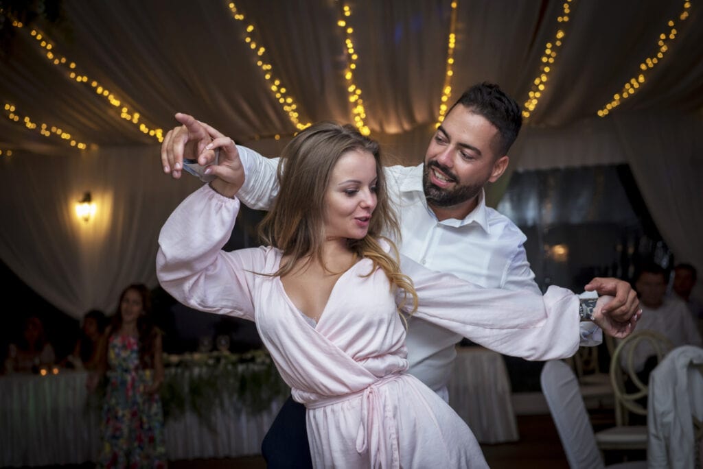 young couple is dancing on the dancefloor