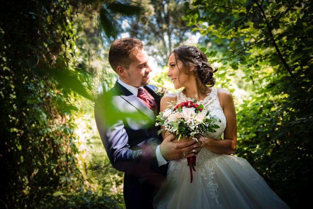 the bride and groom is looking at each other in an absolute ideal nature background