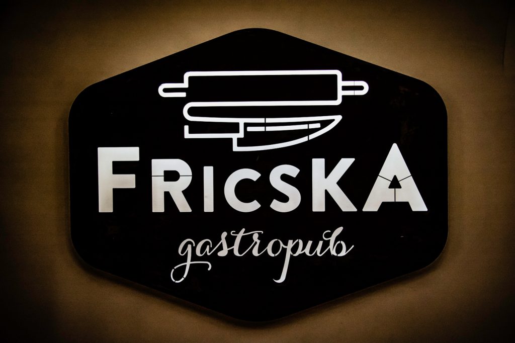 fricska gastropub restaurant sign on the wall