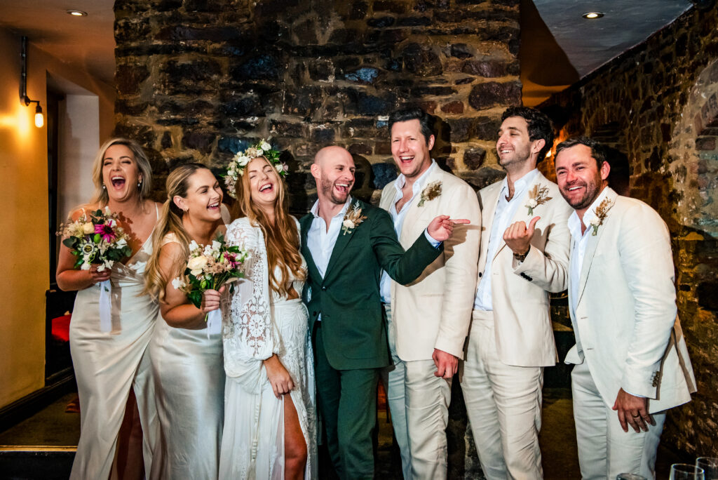 wedding party having fun at a bristol wedding in a pub