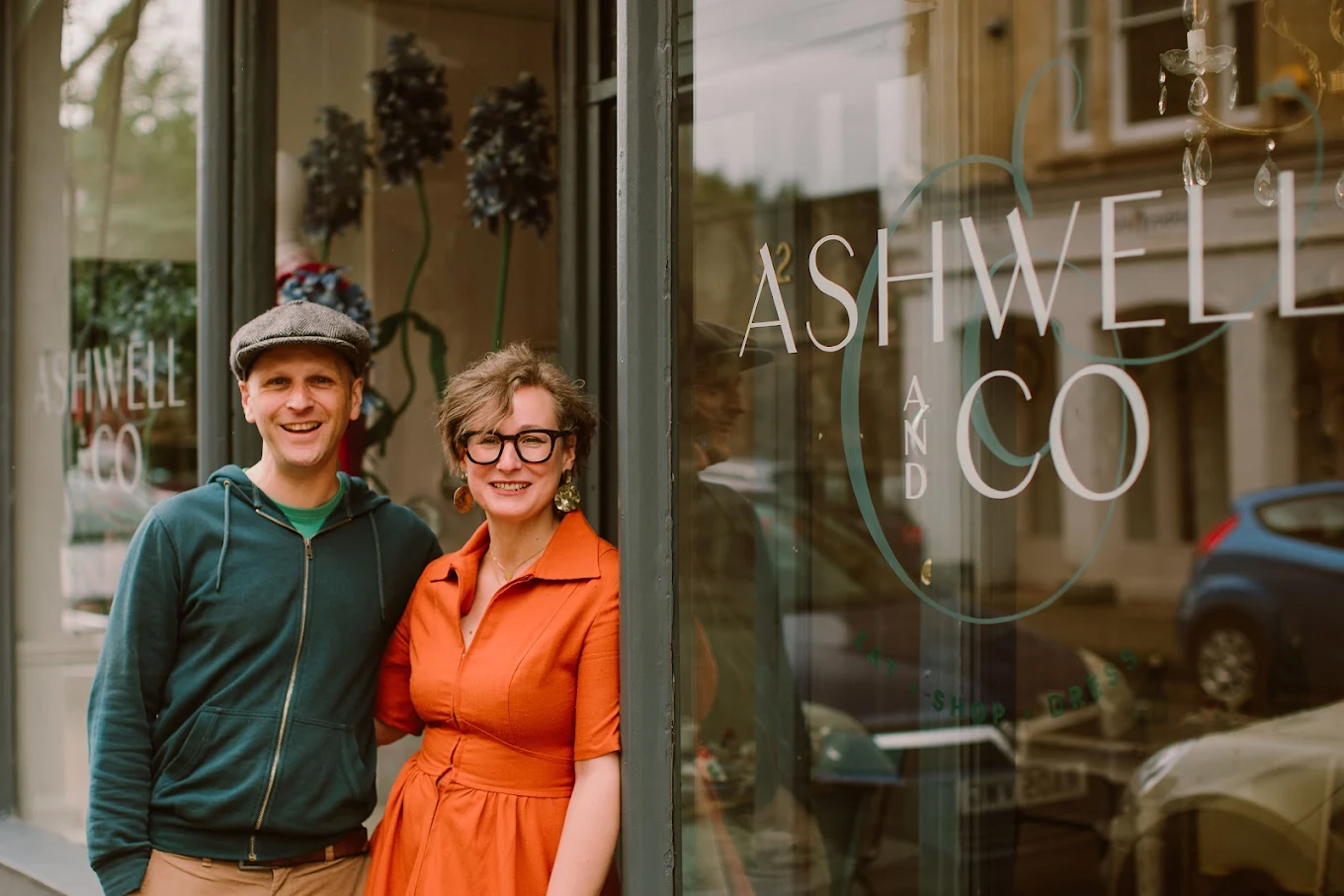 Owners of Ashwell & Co standing outside their Bristol bridal boutique specialising in modern wedding dresses.