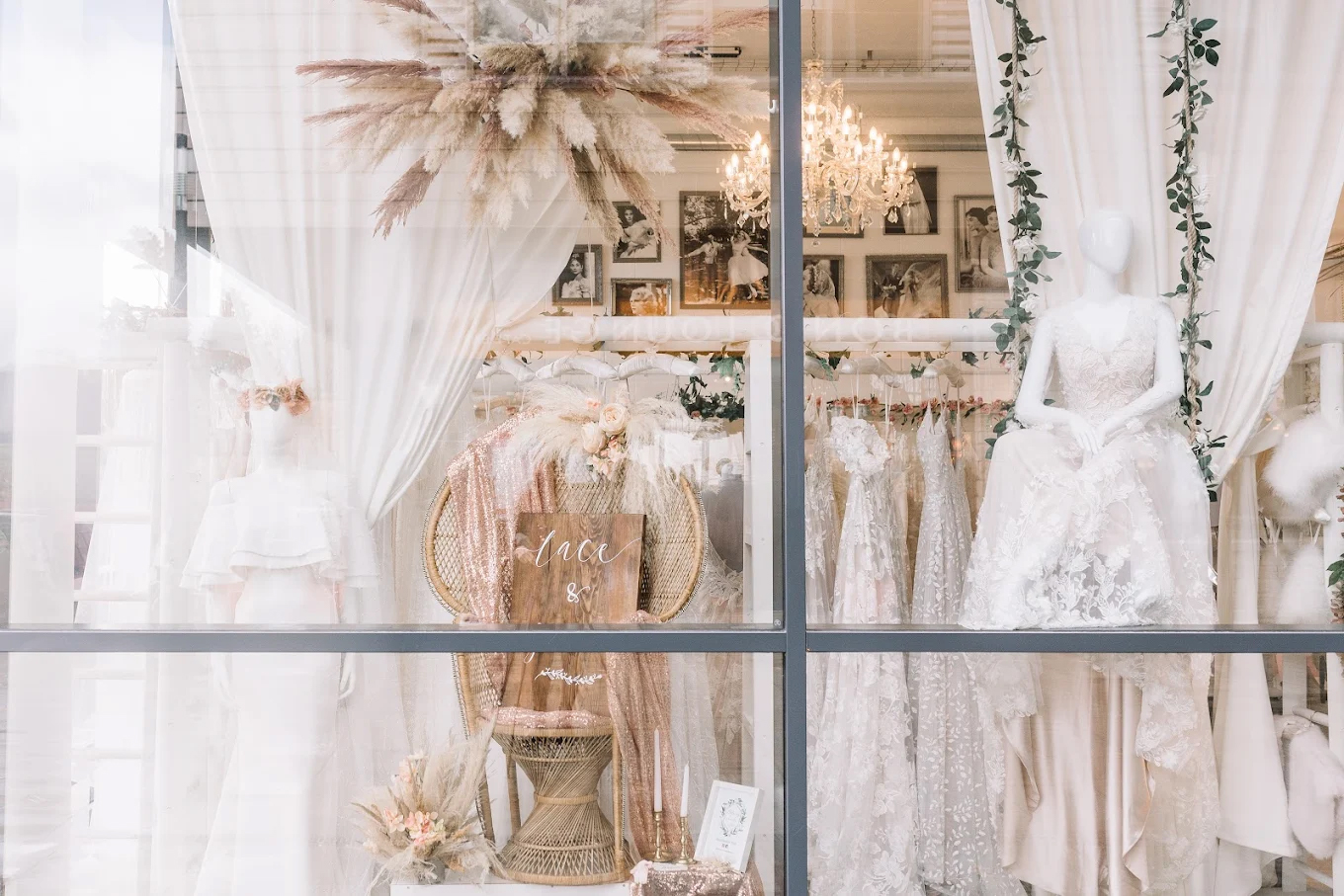 Lace & Grace bridal boutique window display featuring lace wedding dresses and floral decorations in Bristol.