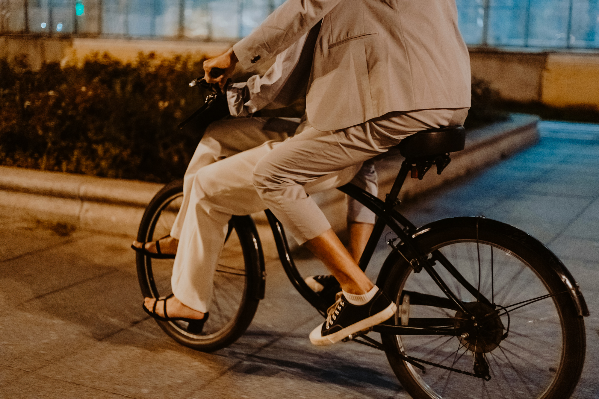 A couple is driving a bicycle