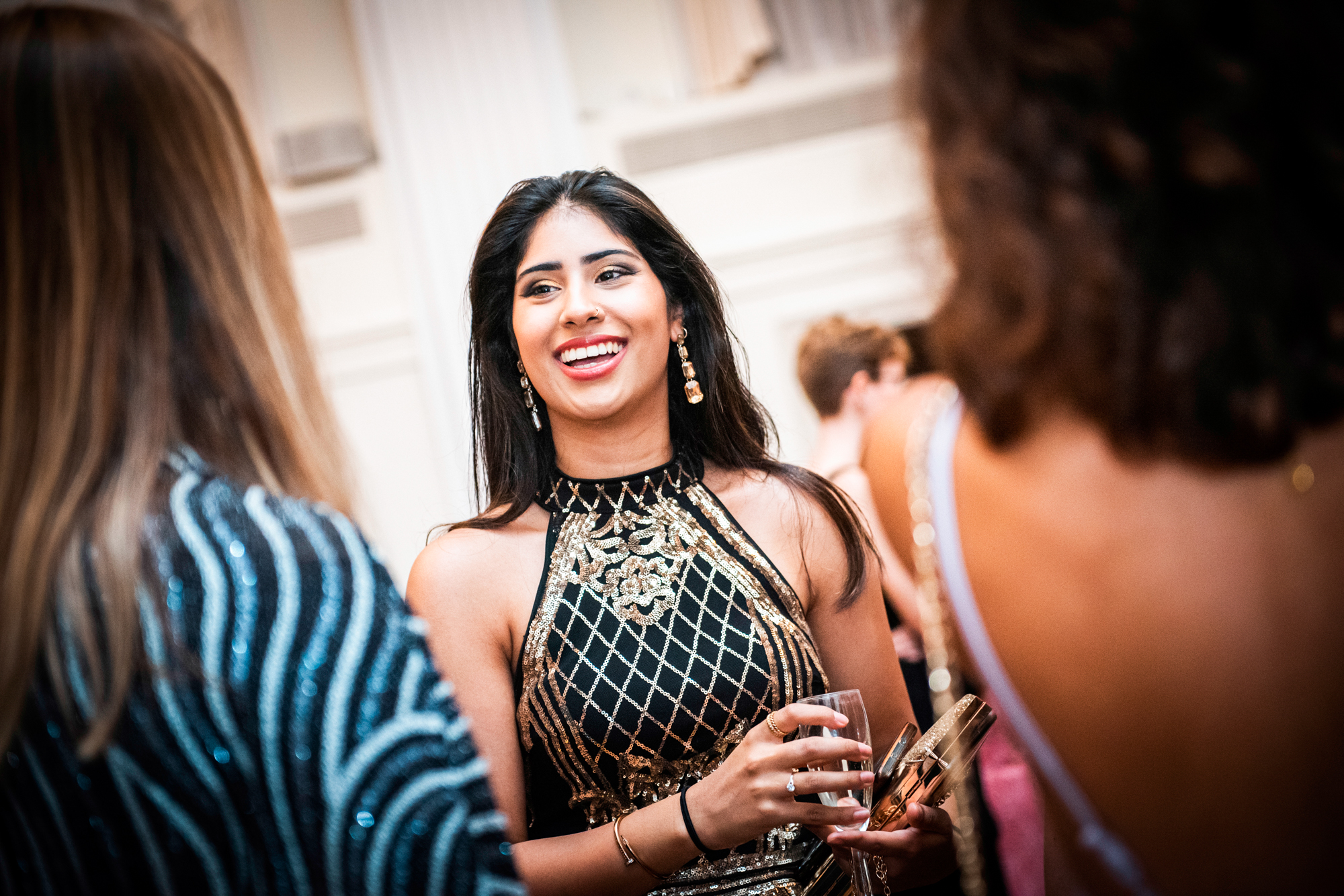 Guest laughing during conversation at the Bristol Grand Hotel gala dinner reception.