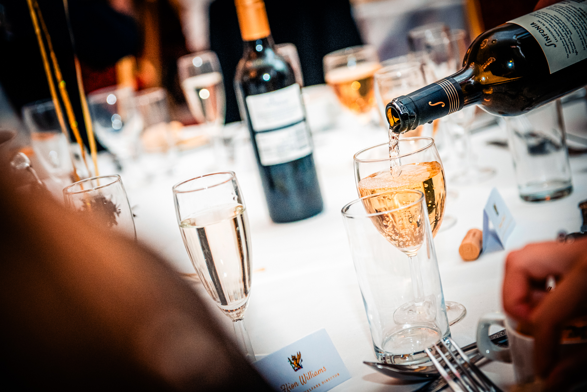 Wine being poured into glasses during the awards dinner at Bristol Grand Hotel.