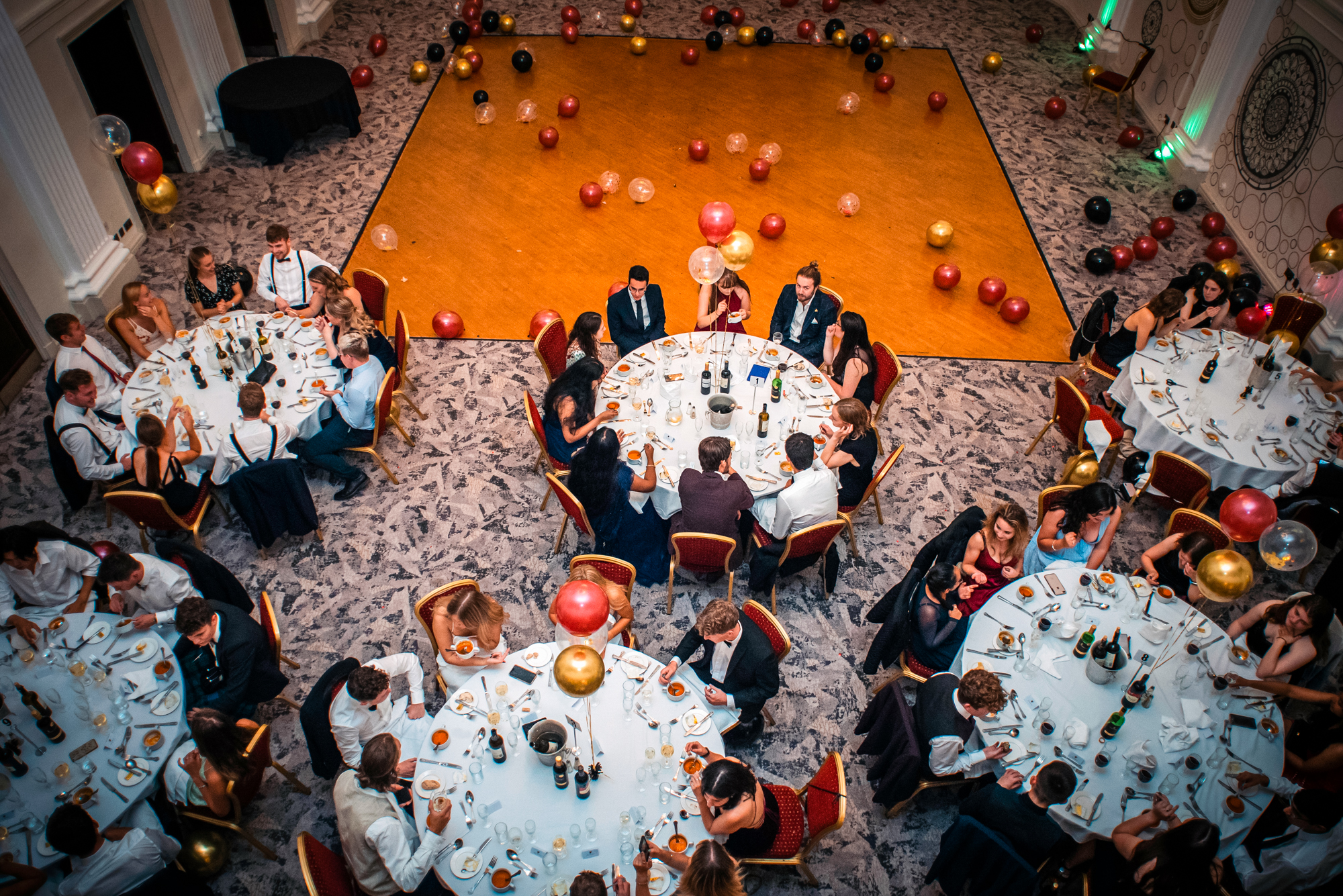 Overhead view of guests dining around decorated tables at the Galenicals Awards in Bristol.