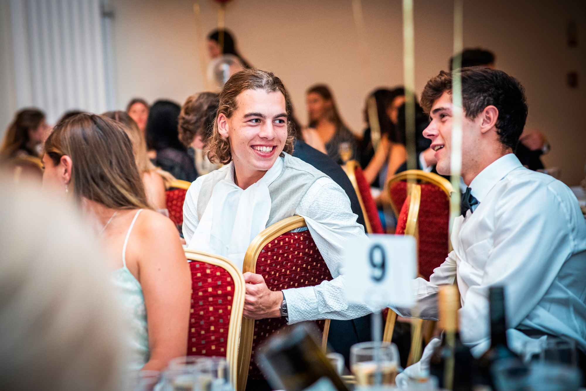 Students chatting and laughing at the Galenicals Awards dinner in Bristol Grand Hotel.