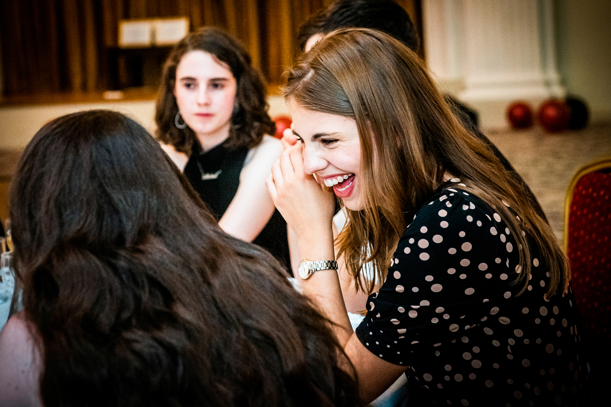 Guest laughing during conversation at the Galenicals Awards dinner in Bristol Grand Hotel.