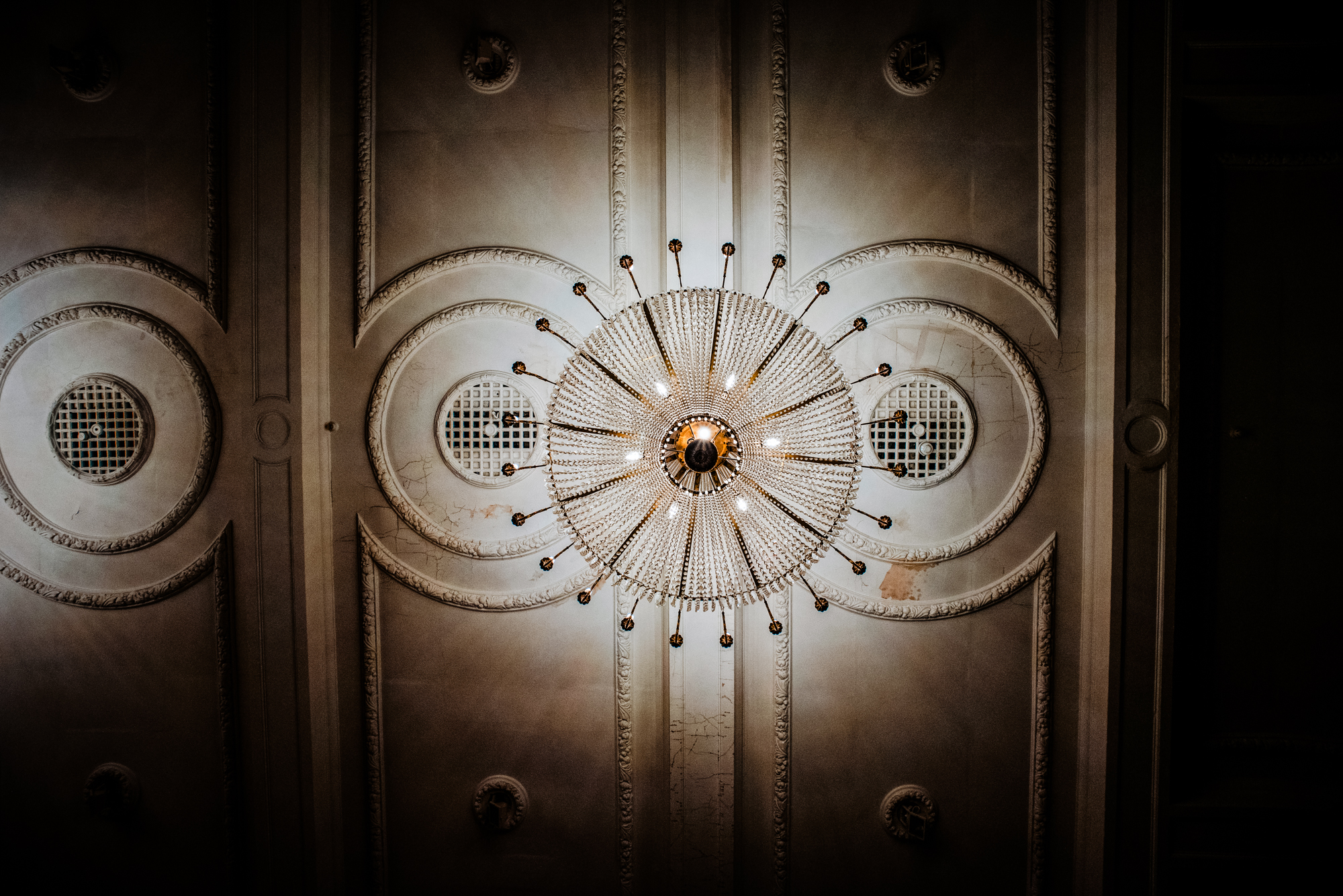 Crystal chandelier hanging above the ballroom ceiling at Bristol Grand Hotel in Bristol.
