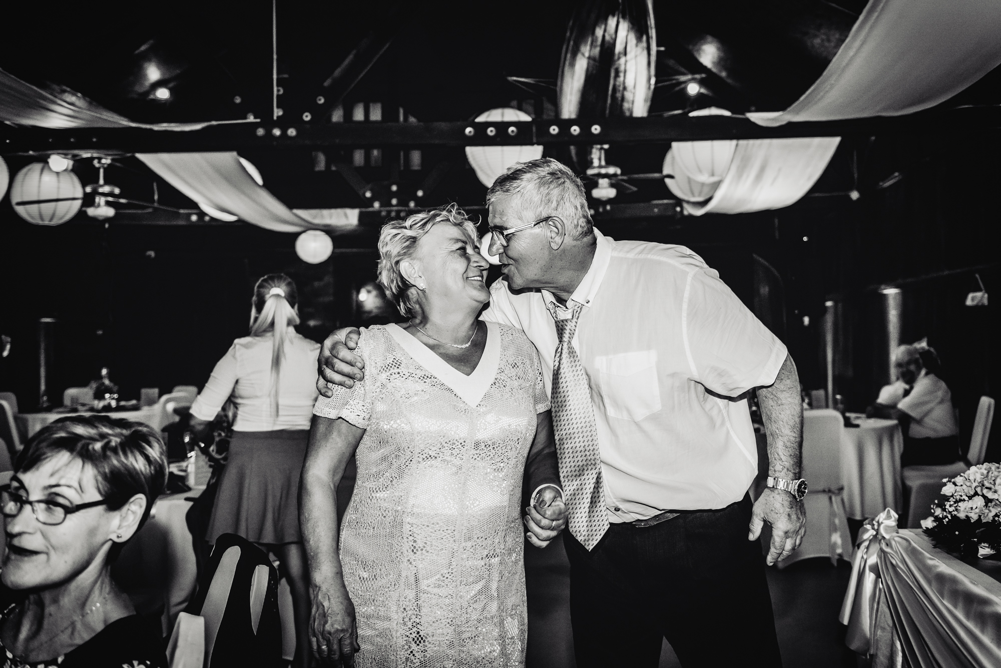 Older couple smiling together on the dance floor during relaxed Budapest wedding reception at Csónakház.