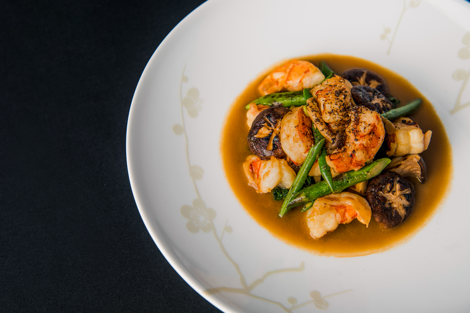 Prawns, scallops, mushrooms, and greens served in a light Japanese broth.