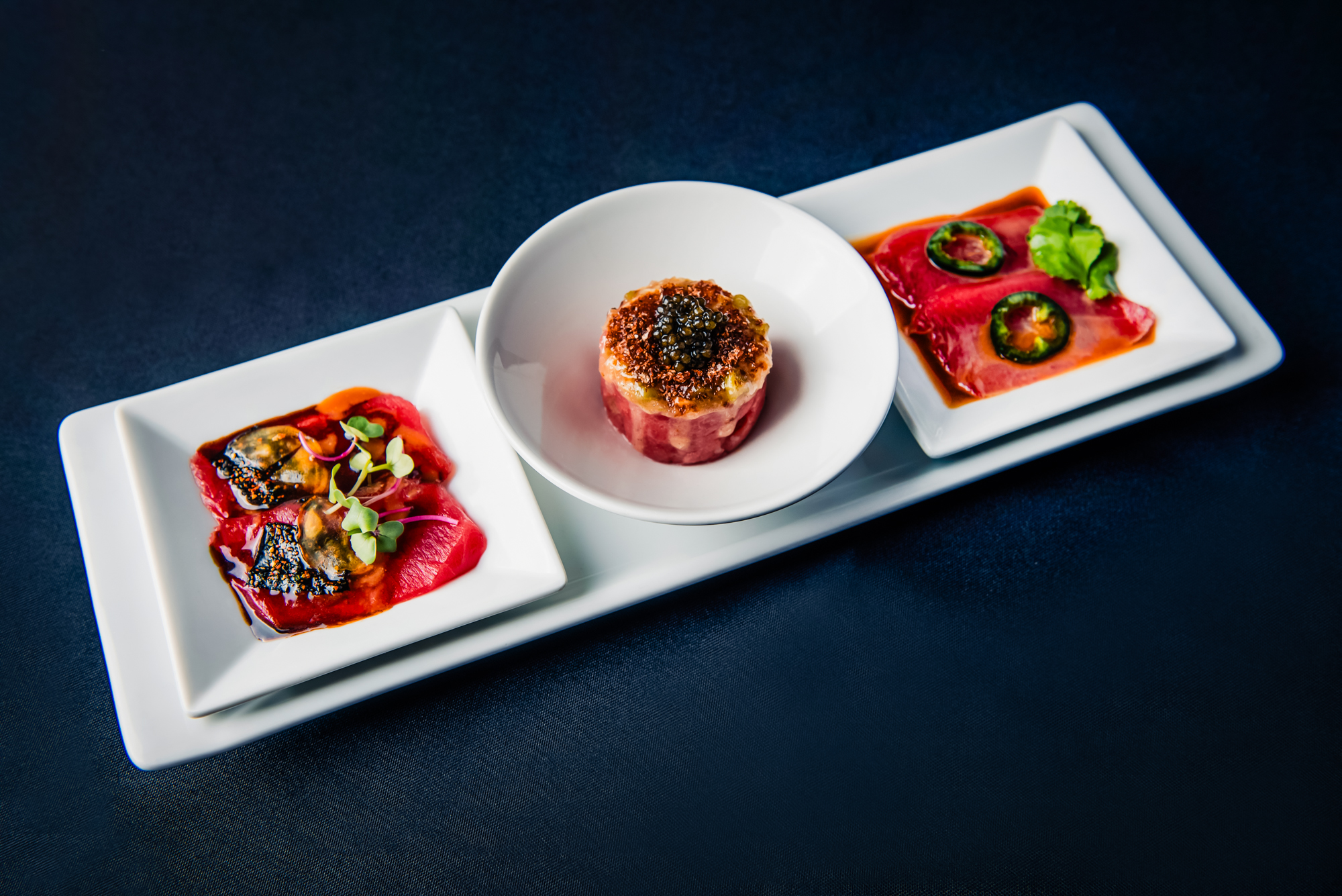 Three-course Japanese tasting selection featuring wagyu, sashimi, and caviar-topped beef.