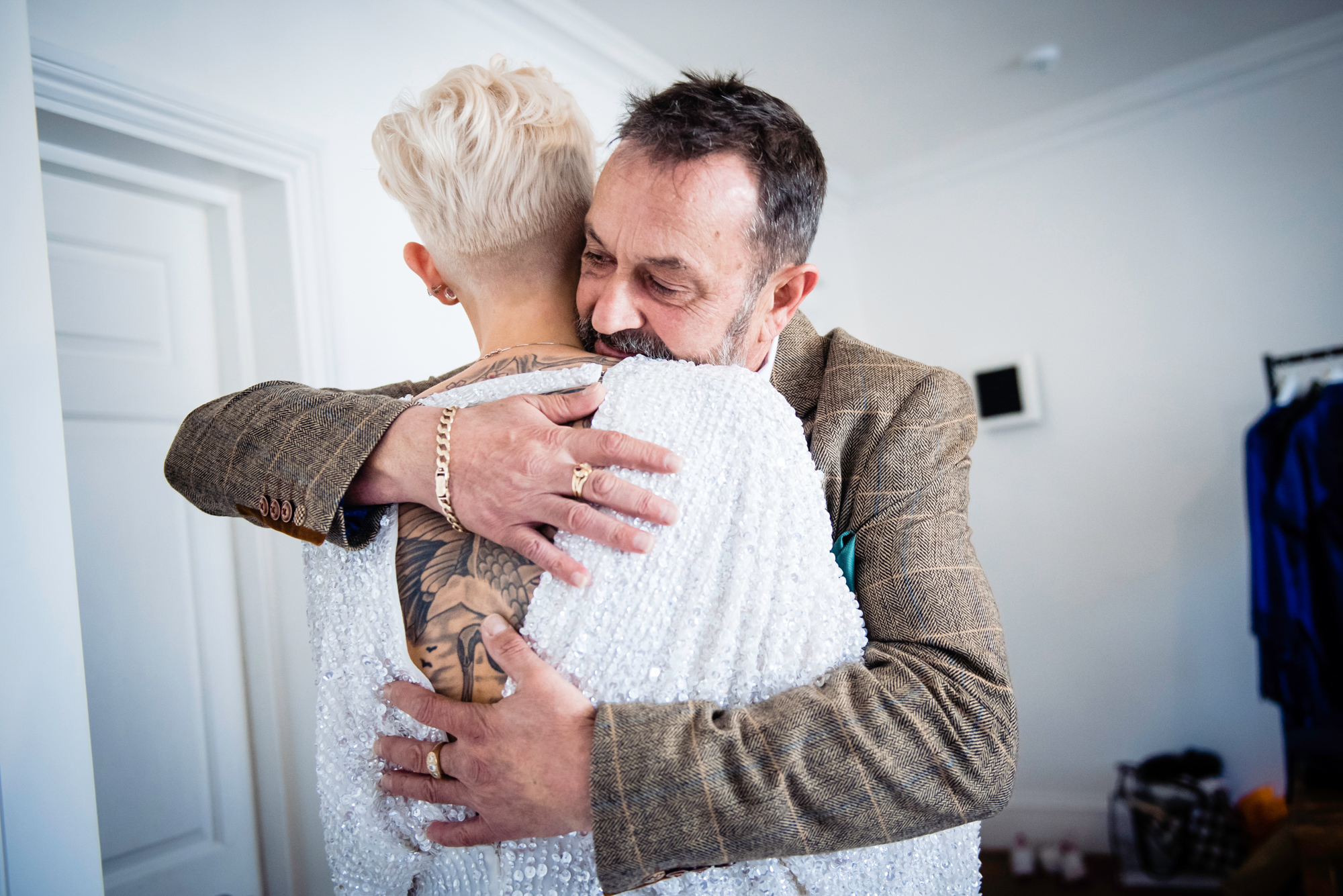 Bride embracing her father tightly moments before walking down the aisle.