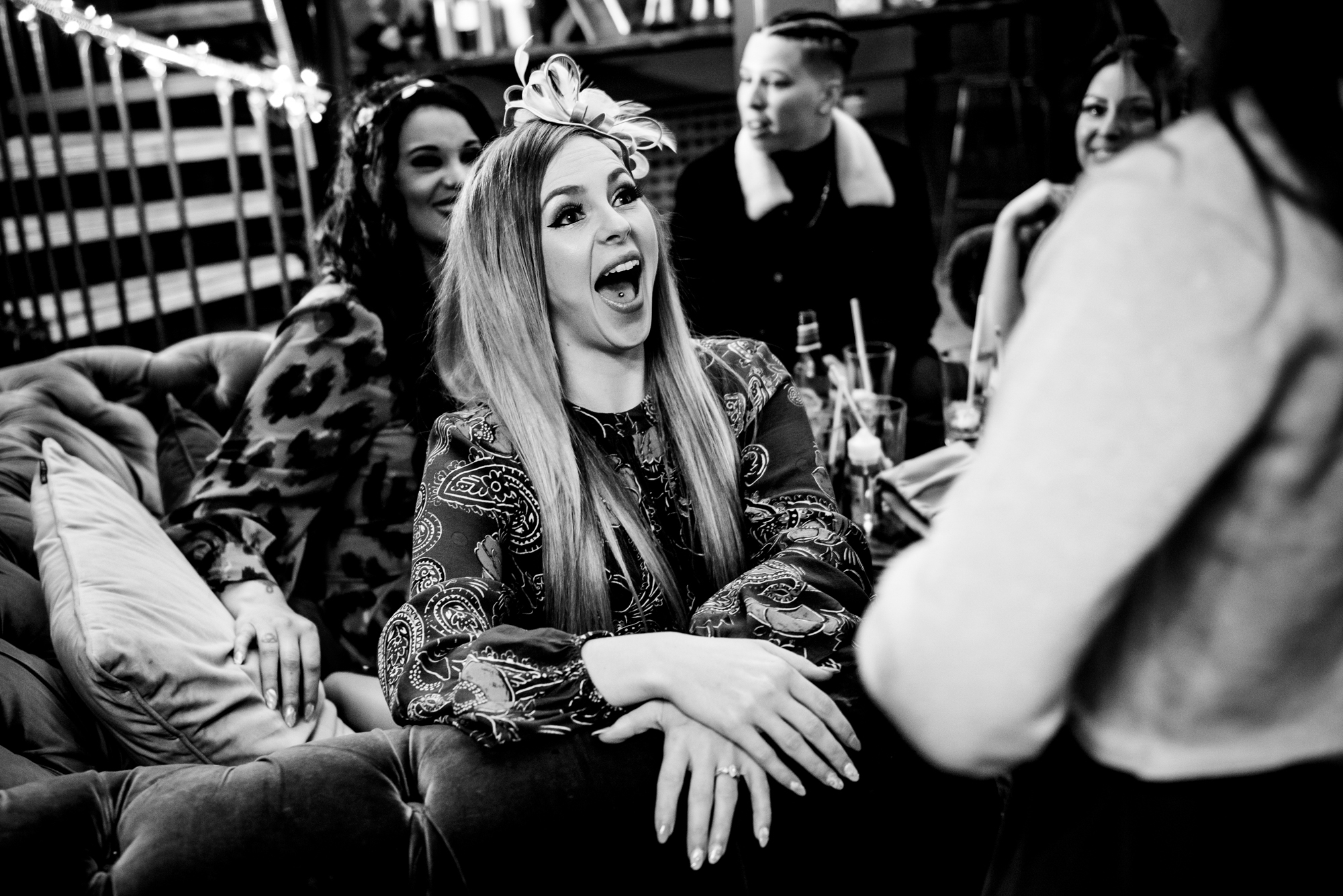 Guest reacting with surprise and laughter during the evening celebrations.
