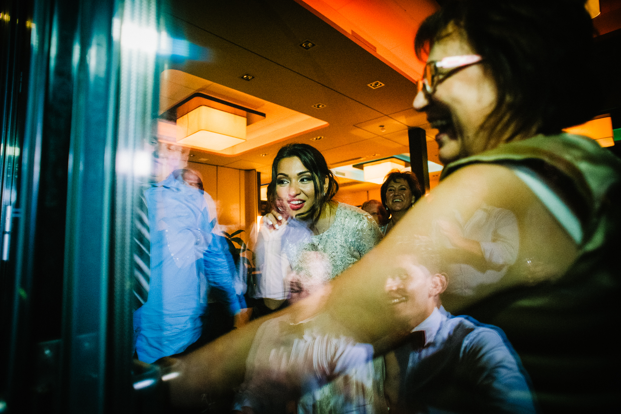 Funny moment of the bride with beautiful window reflection.
