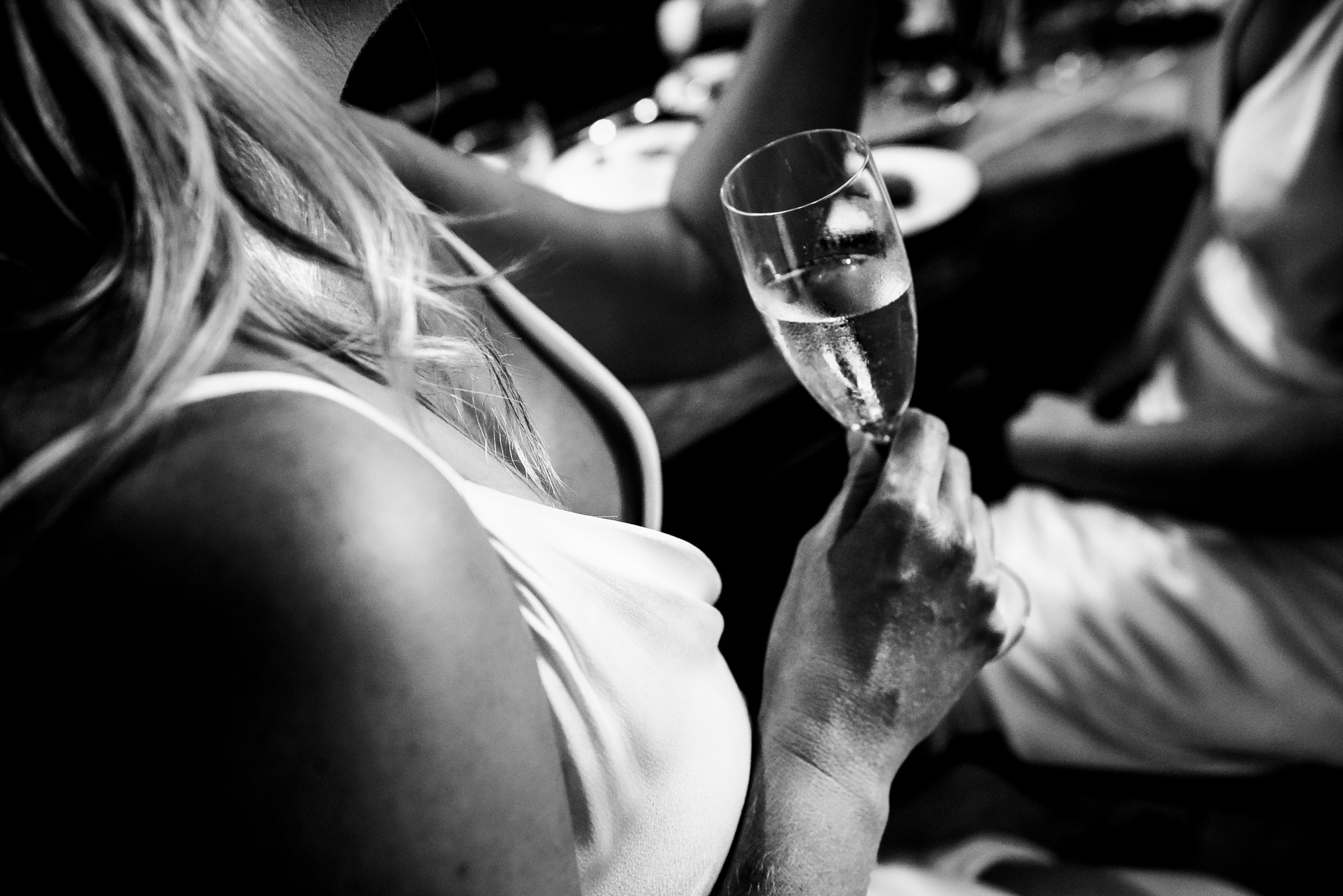 Close-up of pouring champagne into the glass at a wedding reception in Bristol.