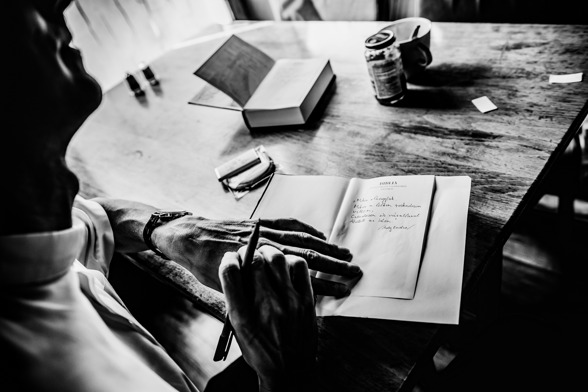 Handwritten dedication inside Bible during christening celebration.