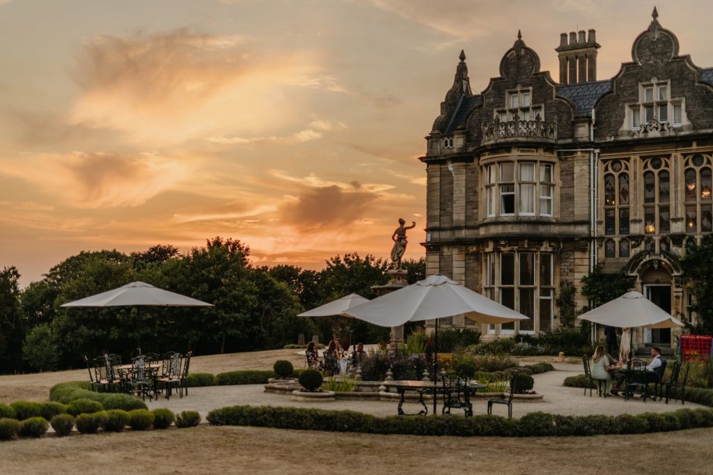 Clevedon Hall wedding venue in Somerset with grand manor house and sunset garden terrace