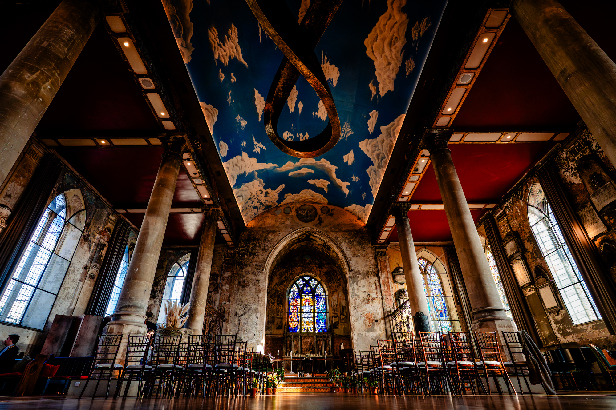 Ceremony space inside The Mount Without wedding venue in Bristol with dramatic painted ceiling and historic church architecture