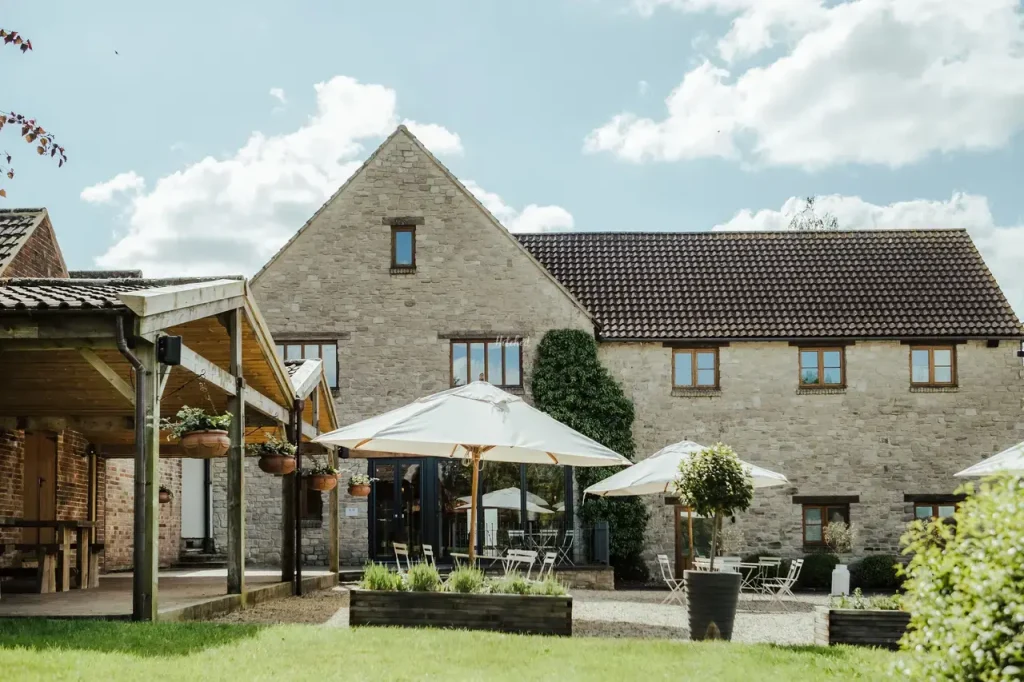 The Barn at Berkeley wedding venue with courtyard and rustic stone buildings