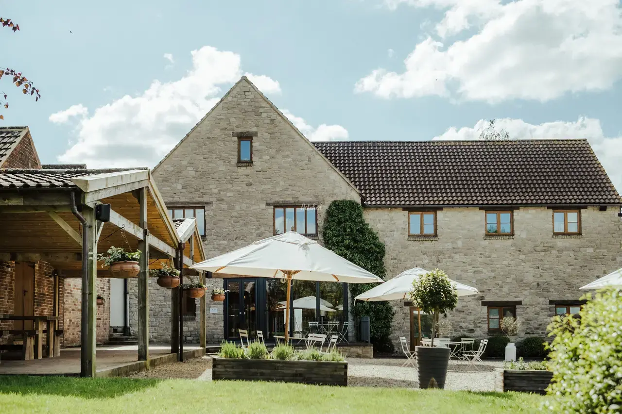 The Barn at Berkeley wedding venue with courtyard and rustic stone buildings