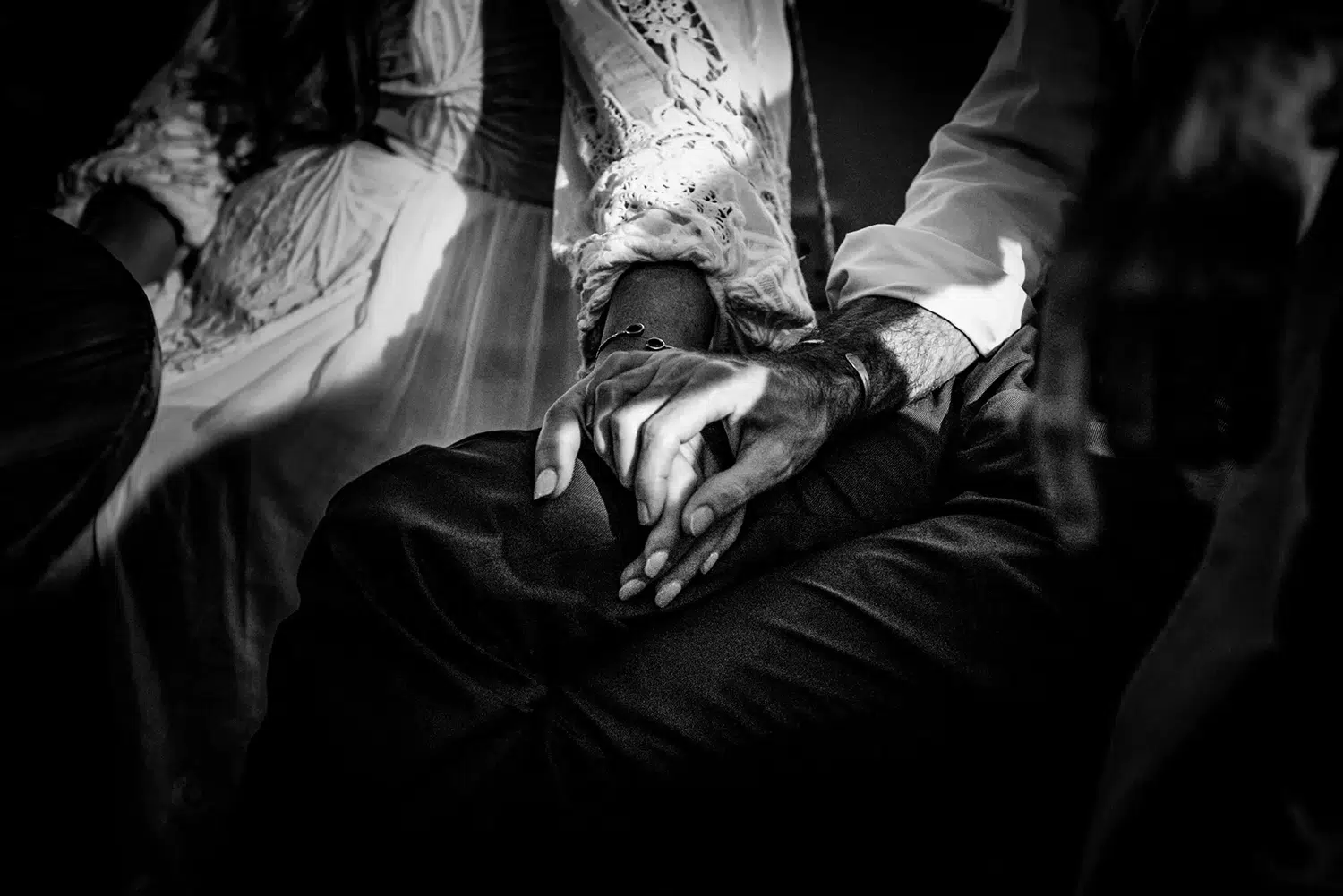 Wedding couple holding hands at their elopement wedding celebration.