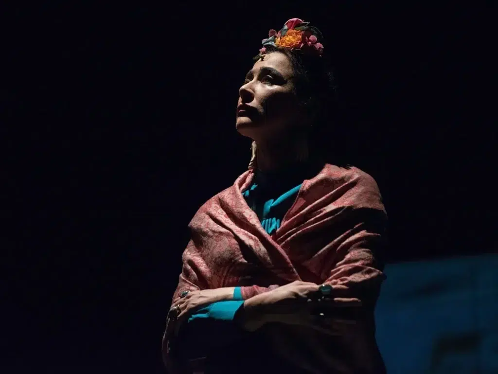 Dramatic stage lighting and performer expression captured by event photographer Bristol