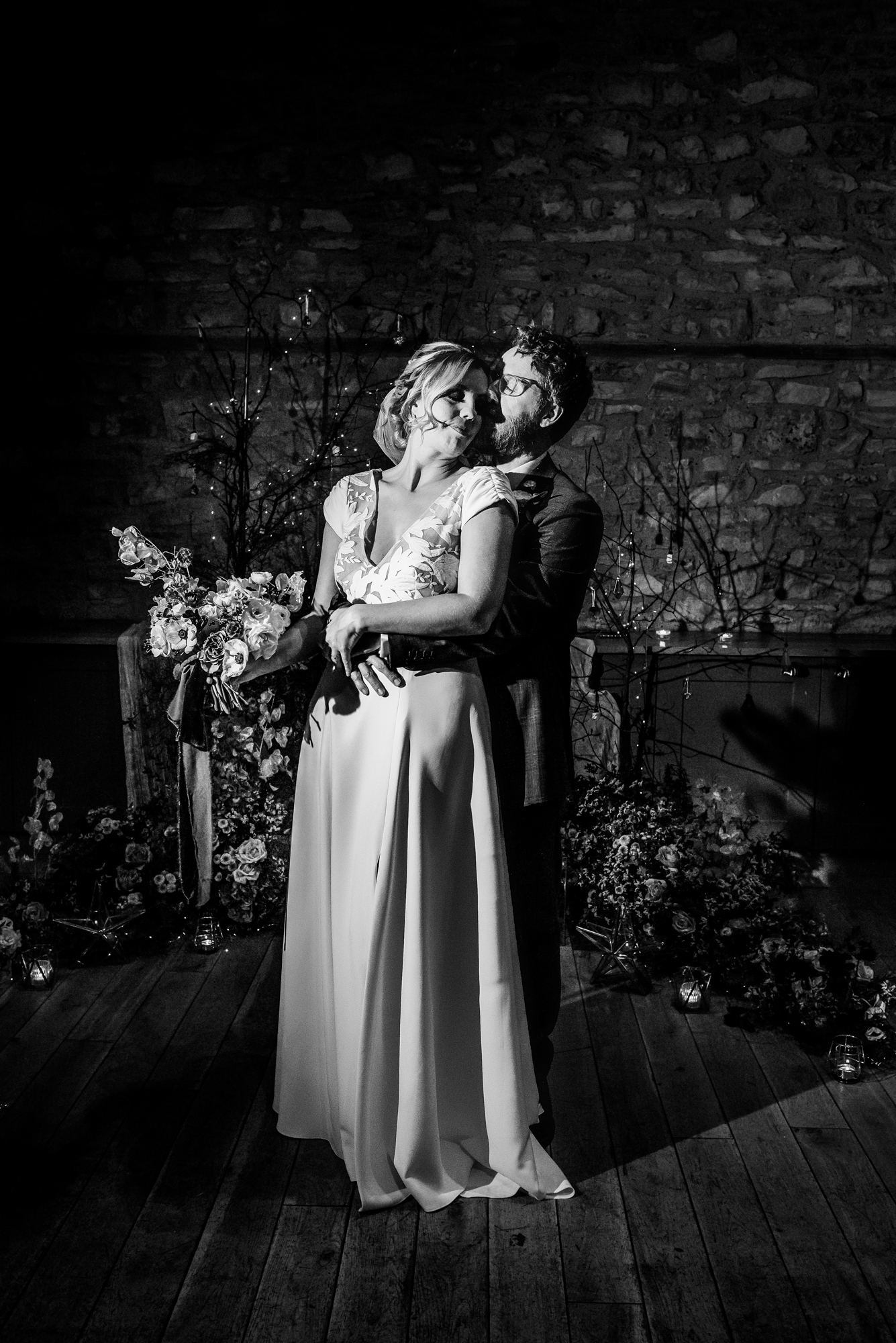 Couple sharing a quiet moment in front of the Starry Night floral installation at Folly Farm Centre.