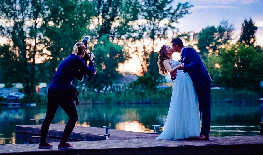 Eszter from Emerald Photo UK behind the scene at a wedding.