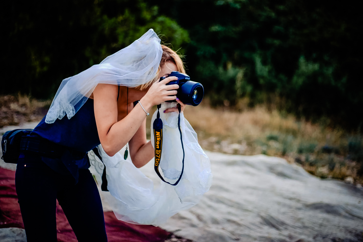Documentary wedding photographer Eszter behind the scenes at wedding.