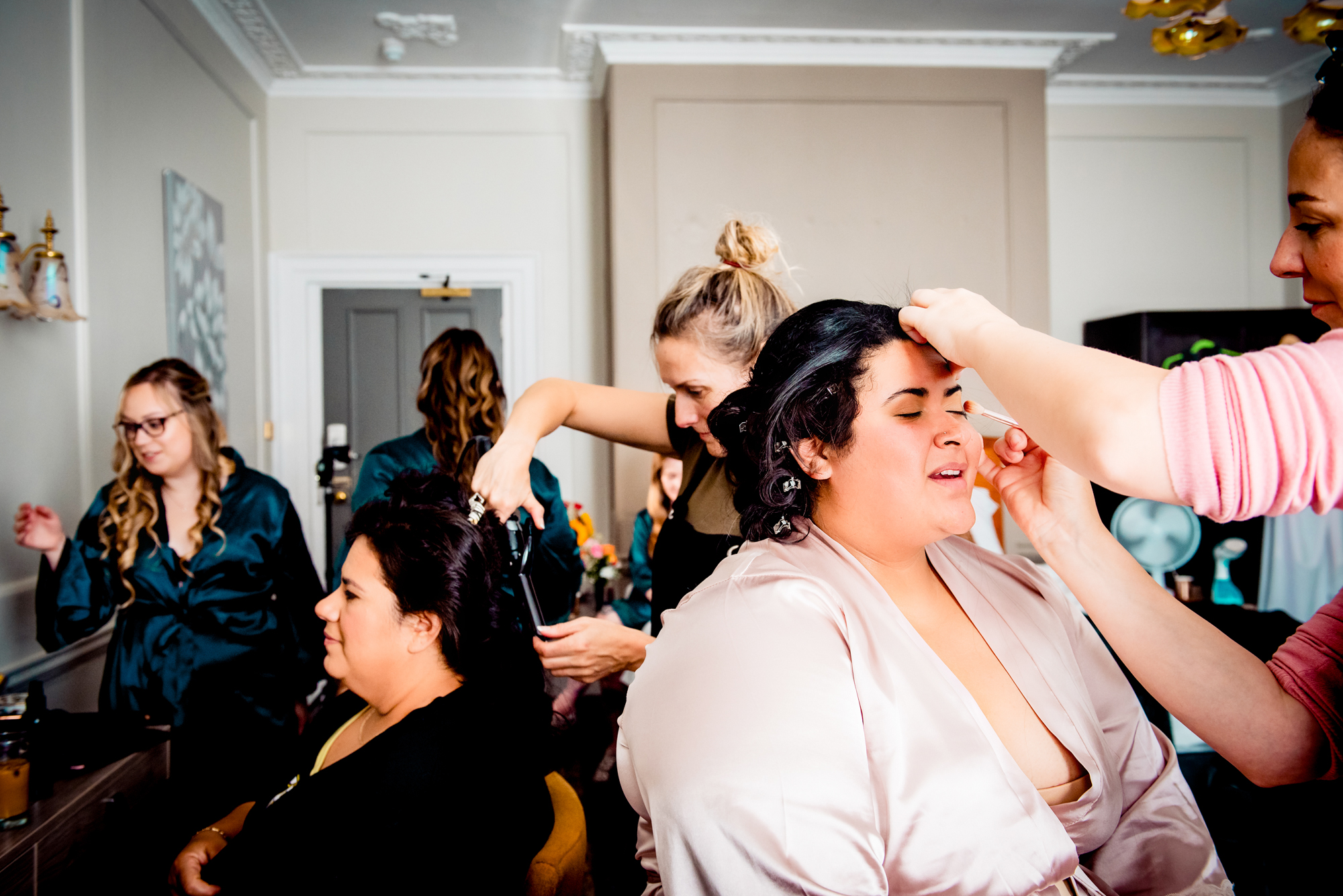 Bridal party getting ready together in robes at Arnos Manor Hotel Bristol wedding photography.