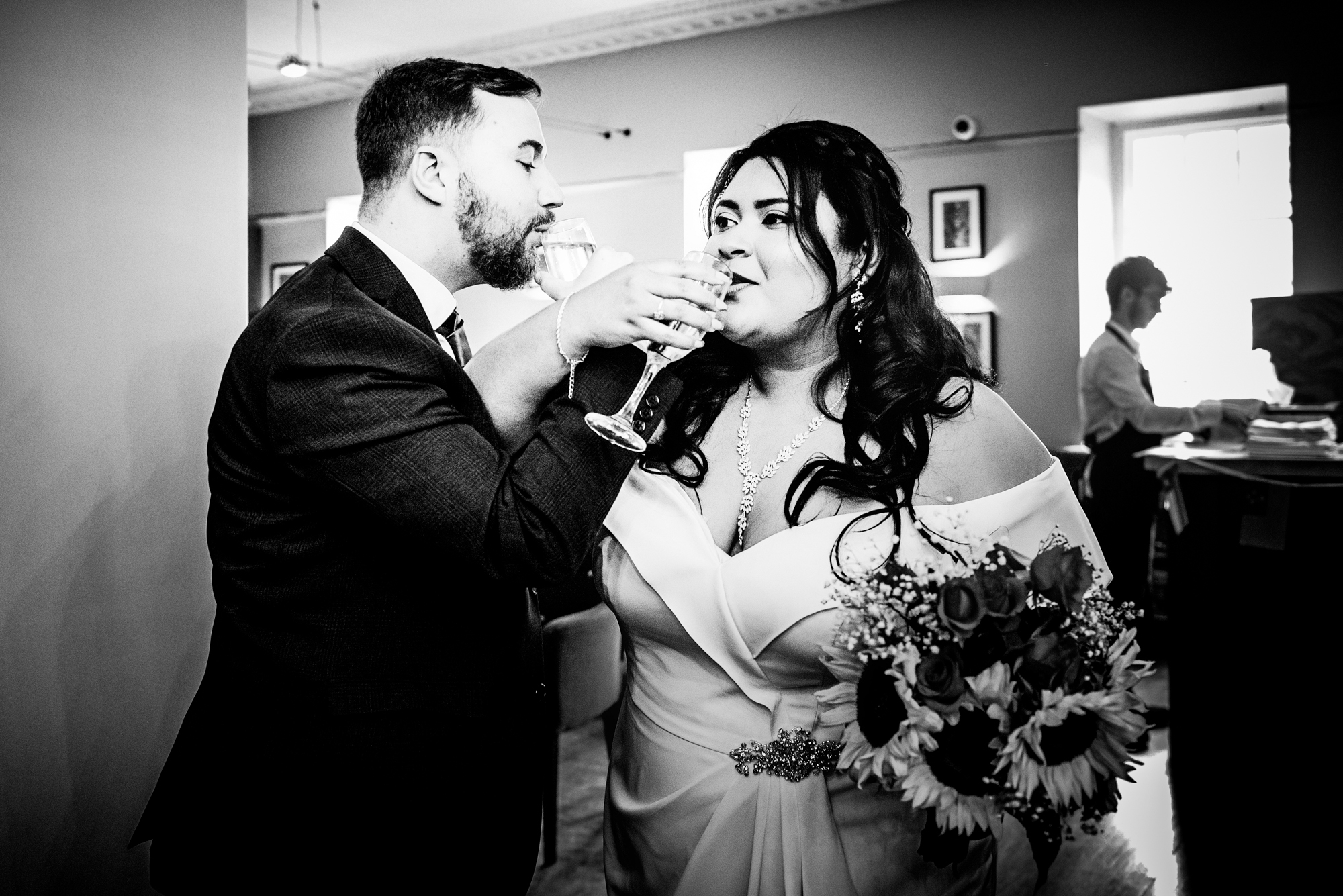 Couple cheers their glasses after got married.