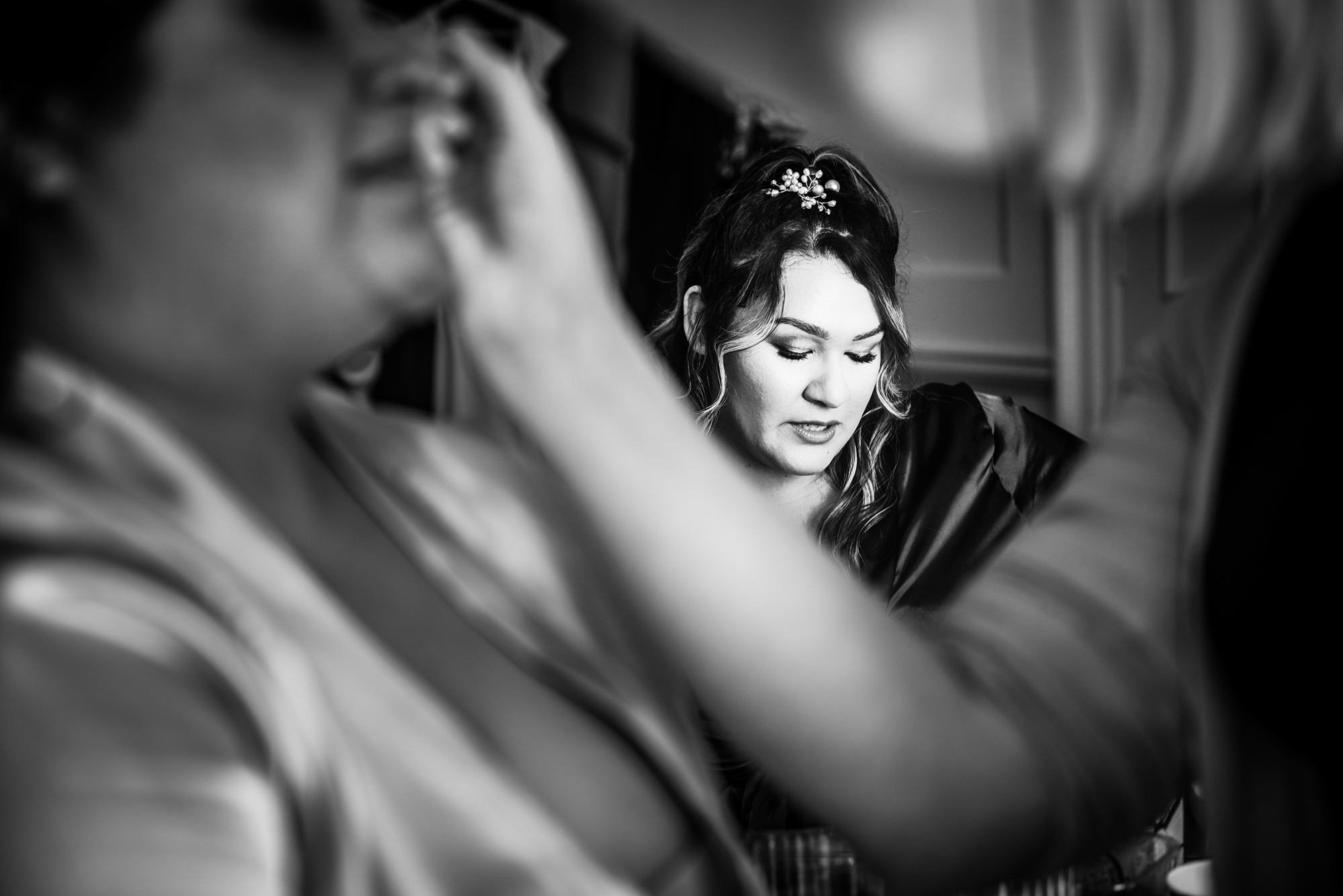 Emotional candid moment of guest reflected in mirror.