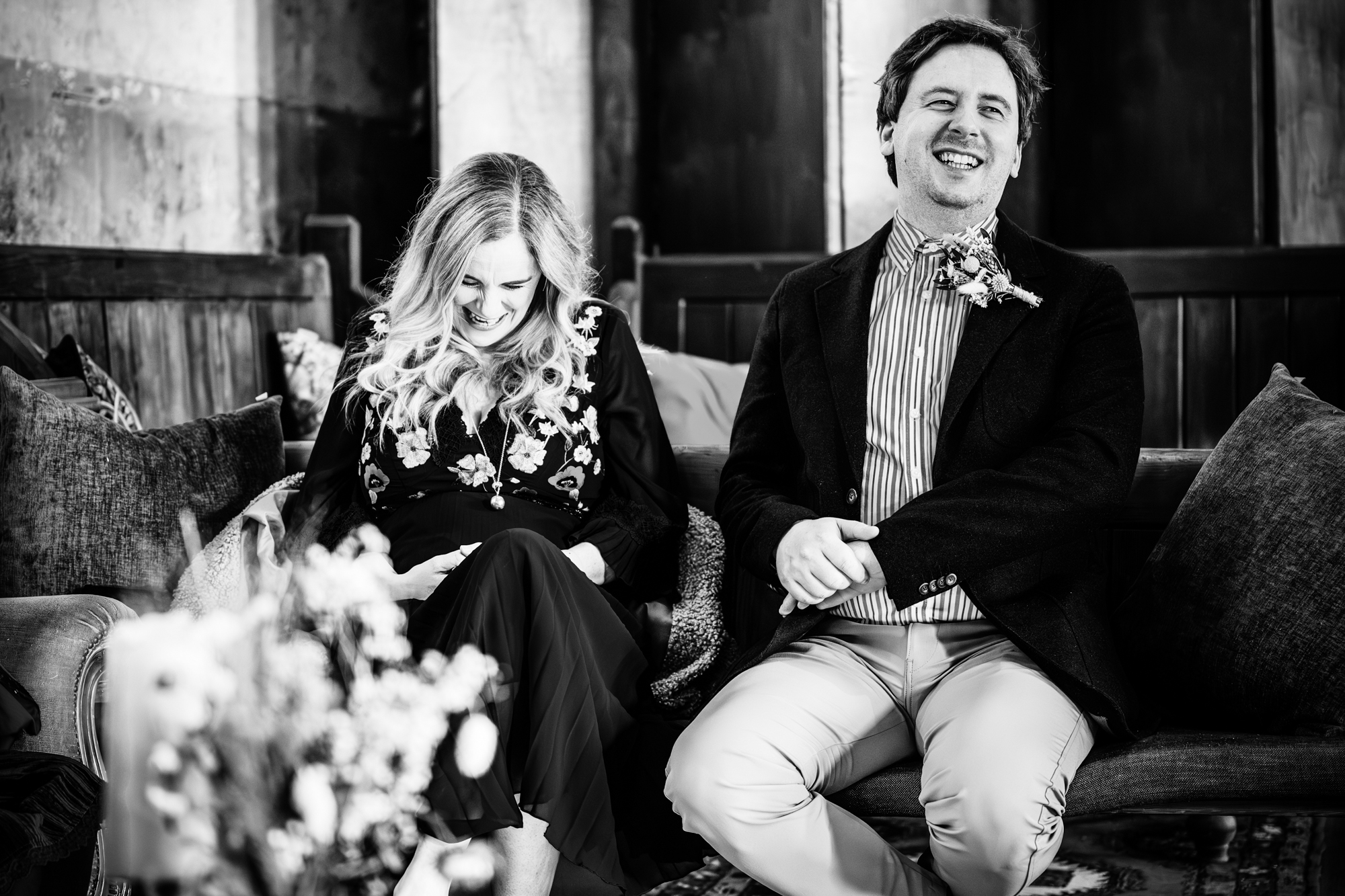 Candid couple moment laughing together.