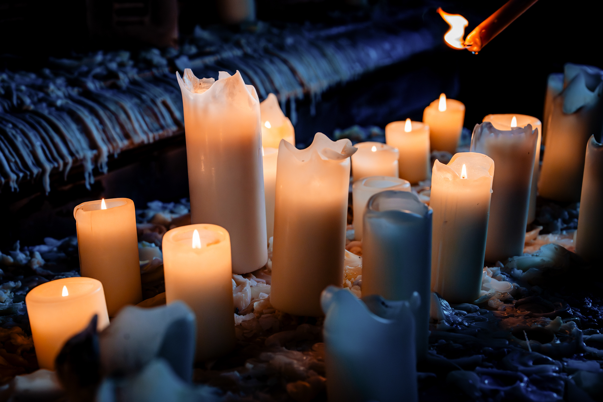 Intimate candle lighting moment creating moody ambience at Mount Without Bristol wedding.