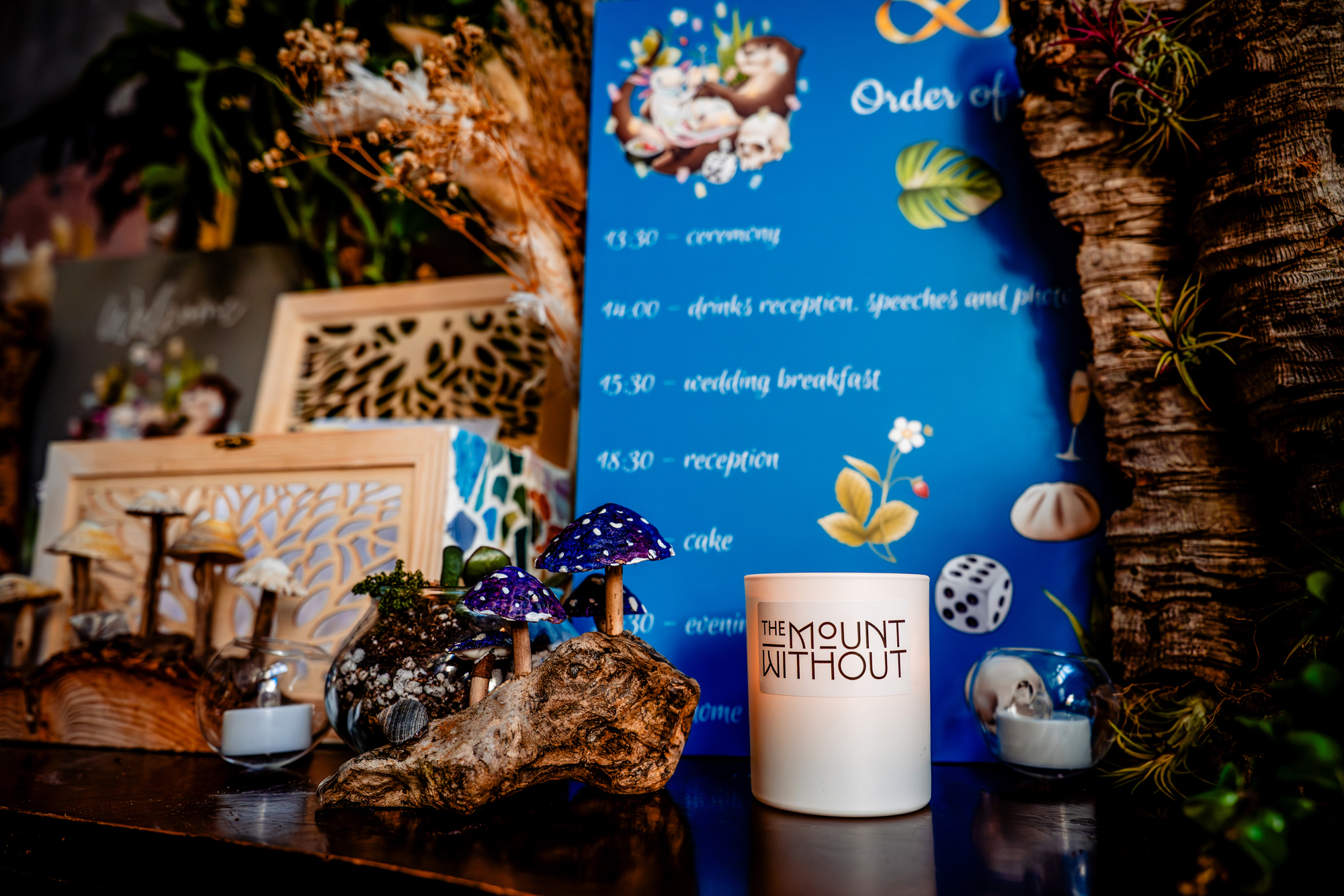 Blue wedding timeline sign with illustrated details and decor at Mount Without Bristol.