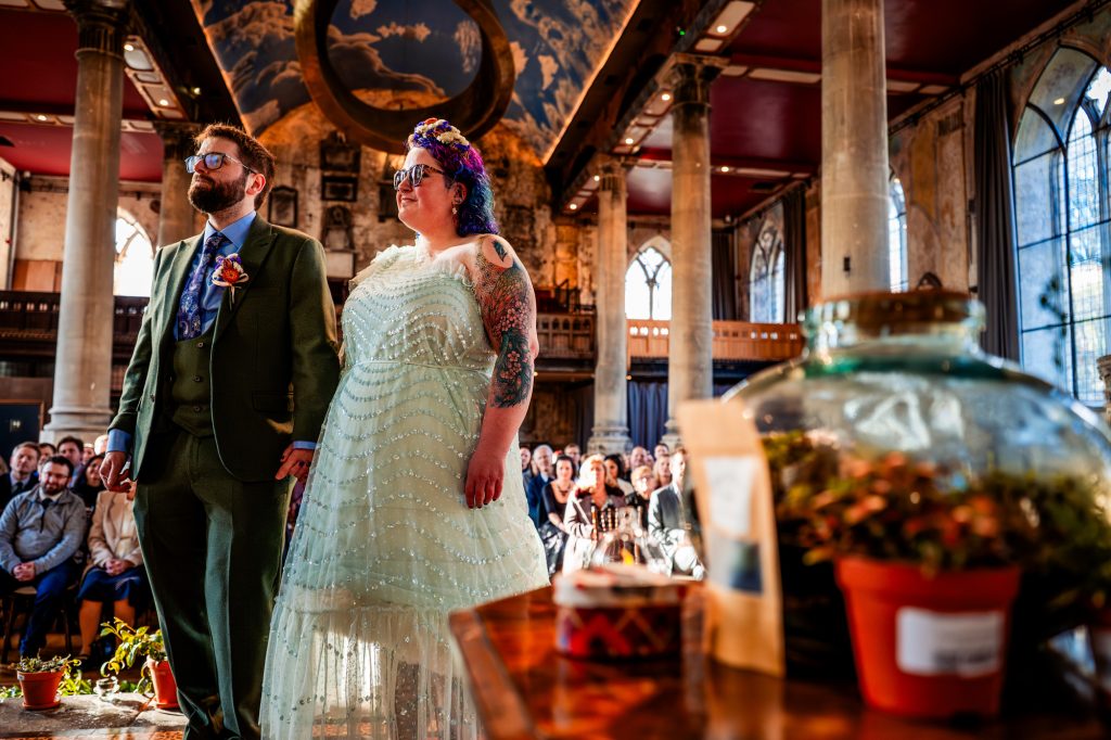 Emotional alternative wedding ceremony in warm natural light at the Mount Without.