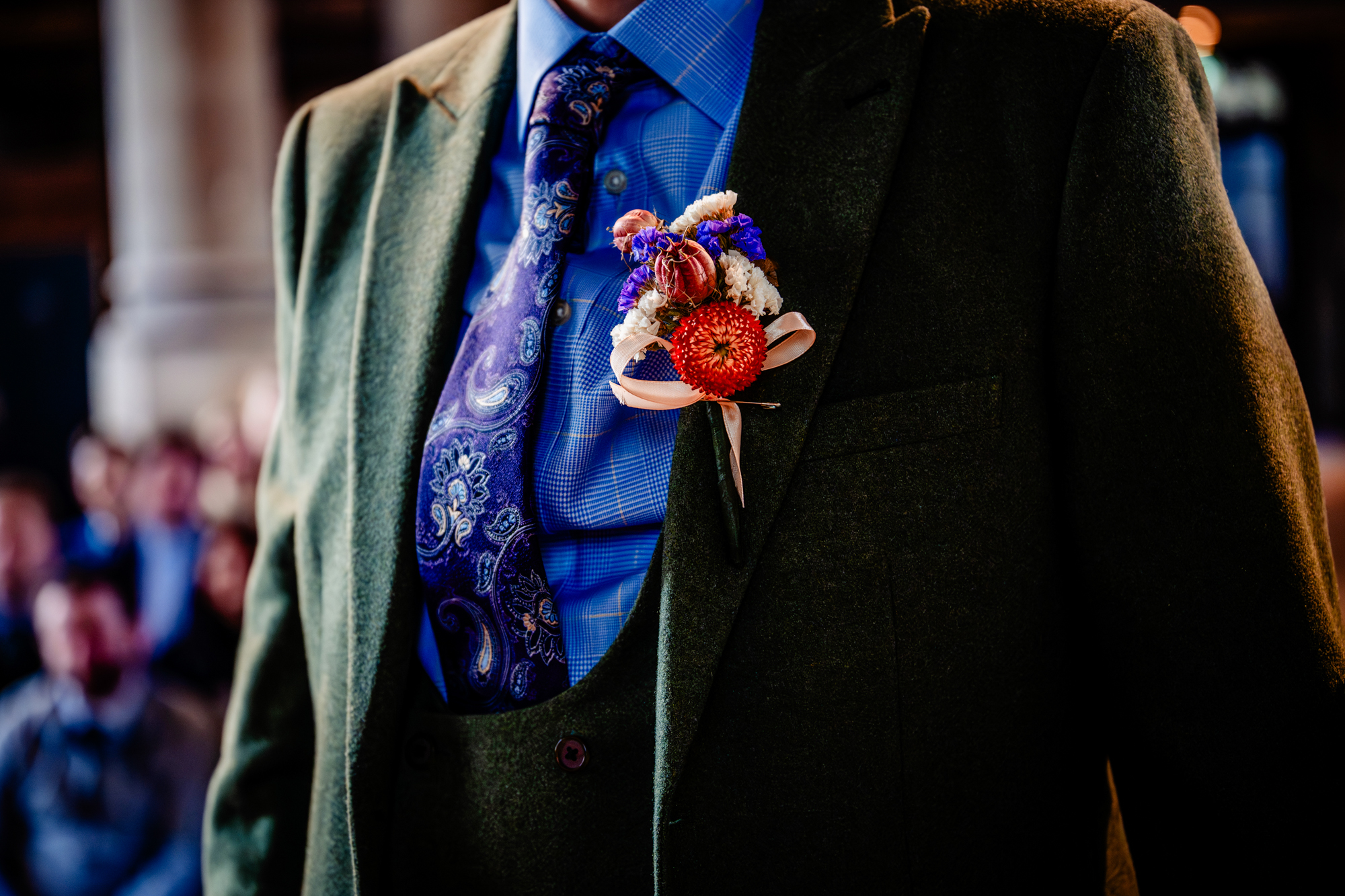 Groom detail with boutonniere and patterned tie