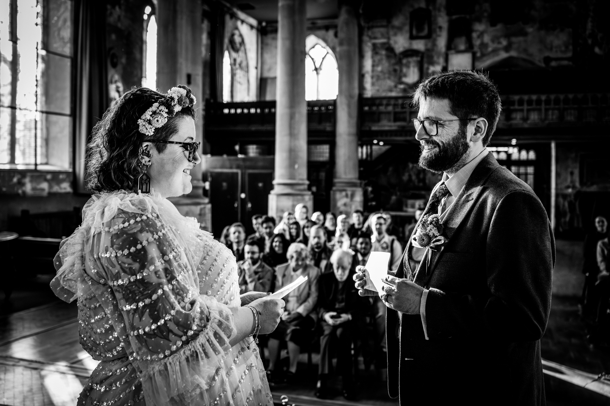 Wedding ceremony guests watching couple during vows at The Mount Without Bristol.