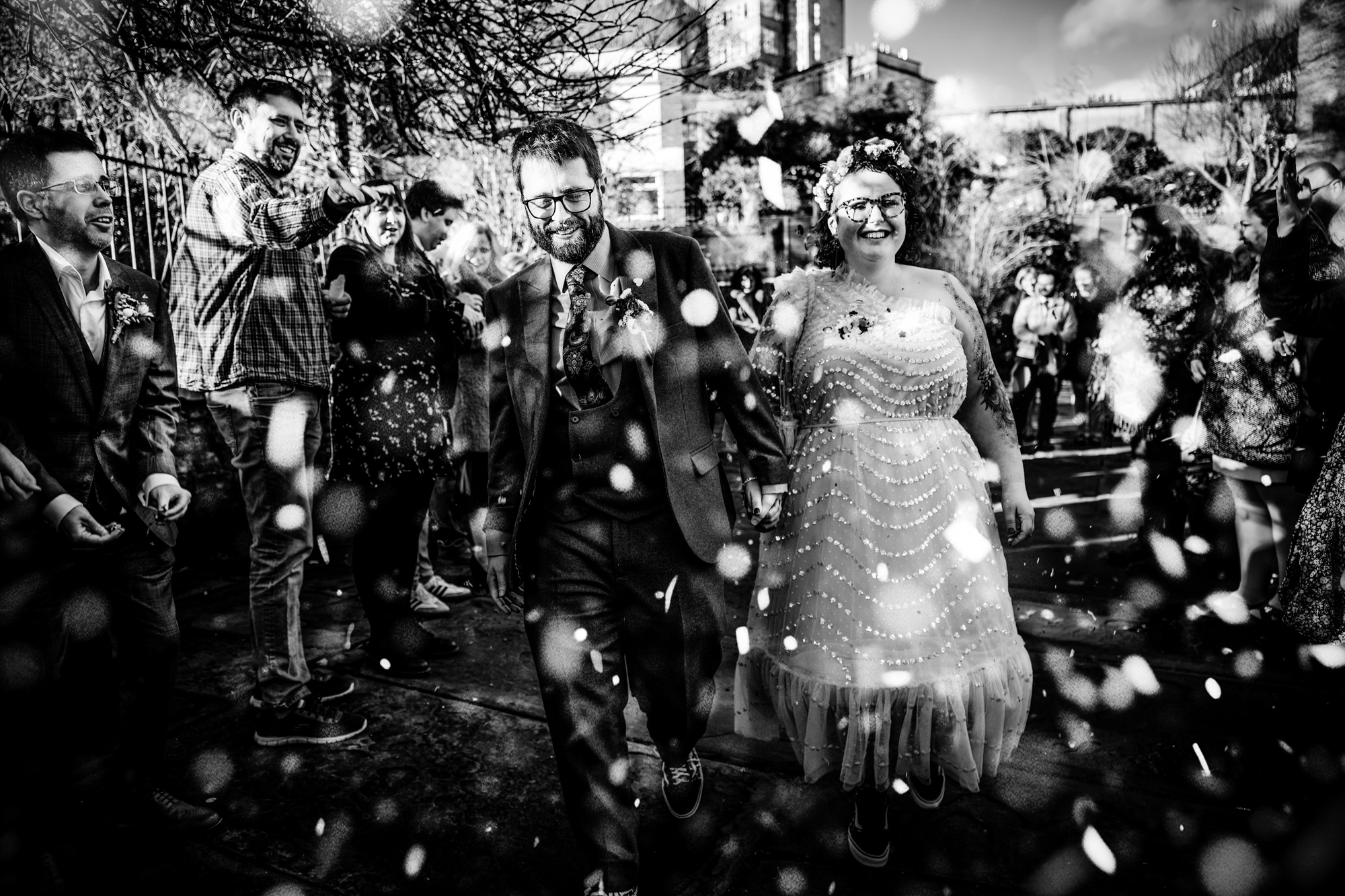 Confetti exit outside The Mount Without Bristol with guests celebrating newlyweds.