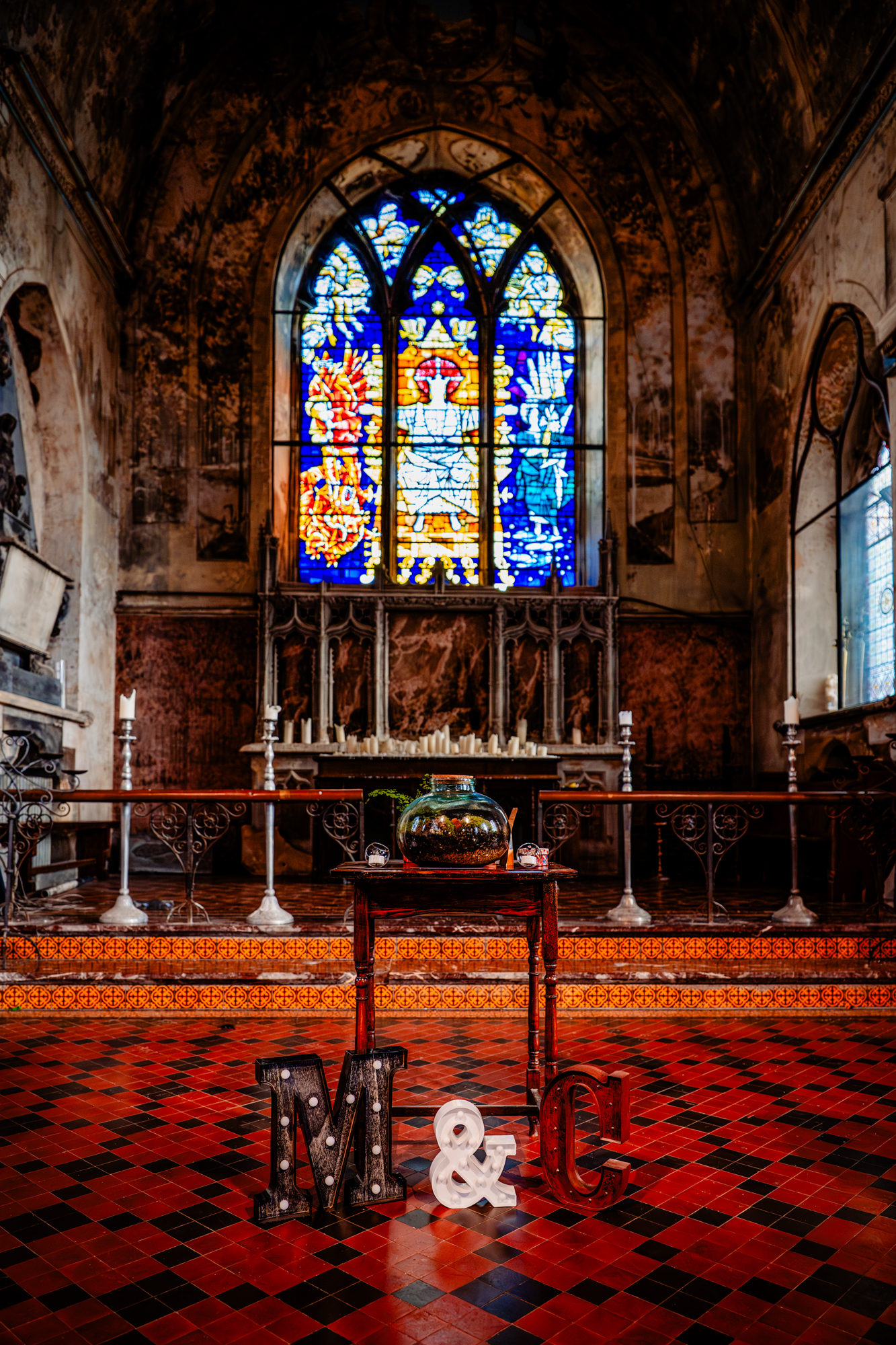 Ceremony setup with stained glass and terrarium altar at Mount Without Bristol wedding venue.