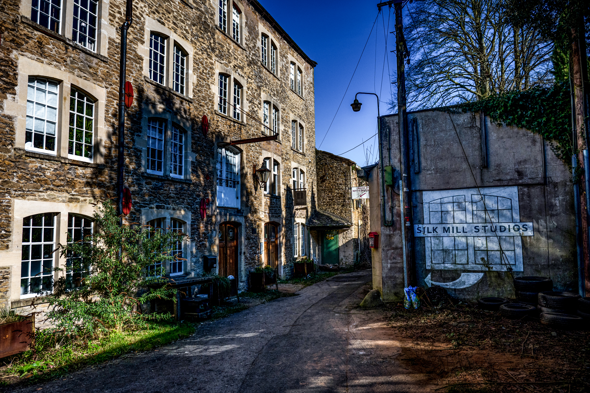 Exterior of Silk Mill Studios and surrounding stone buildings in Merchants’ Barton, Frome.