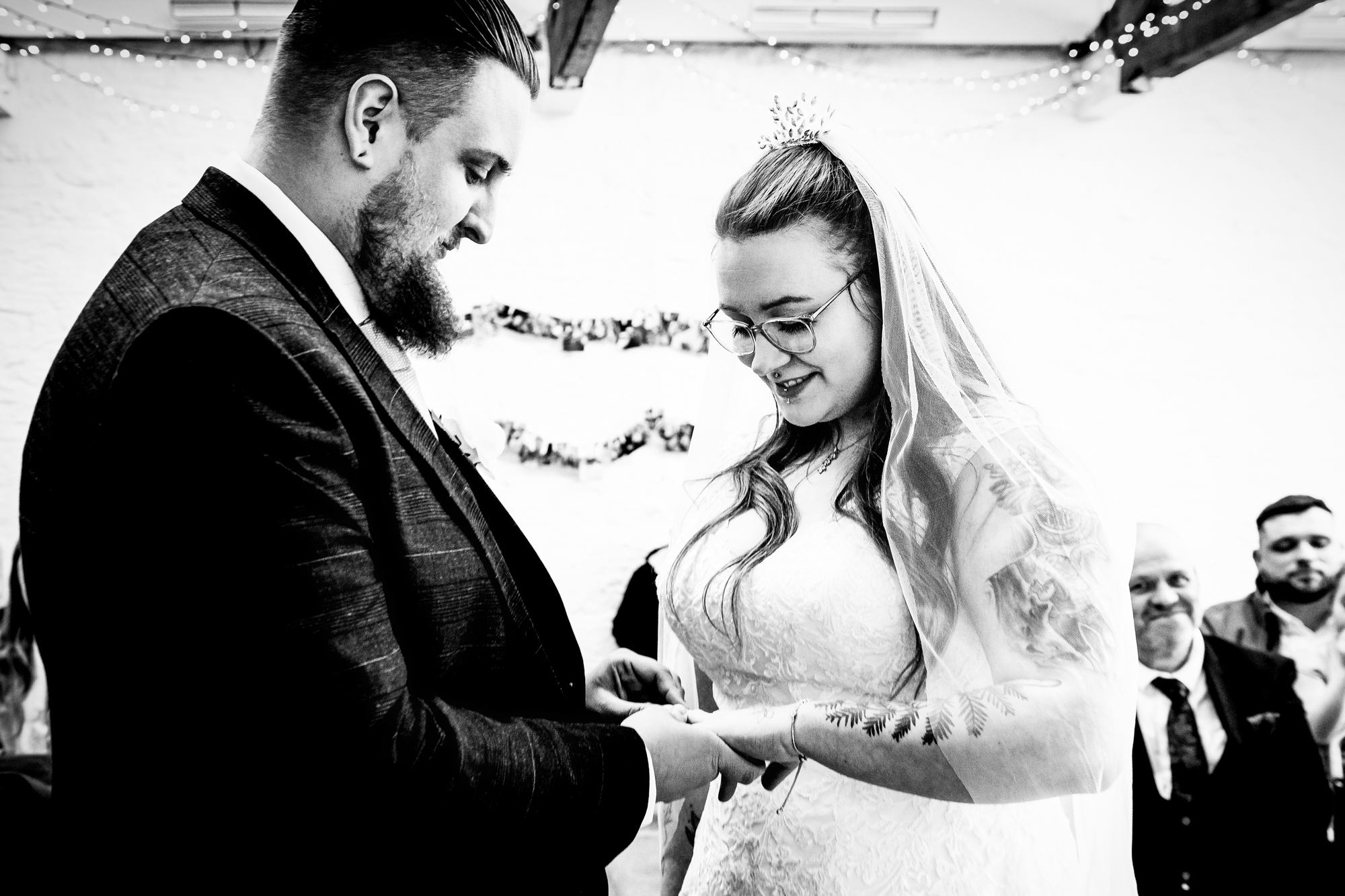 Jon places a wedding ring on Nat’s finger during the ceremony.