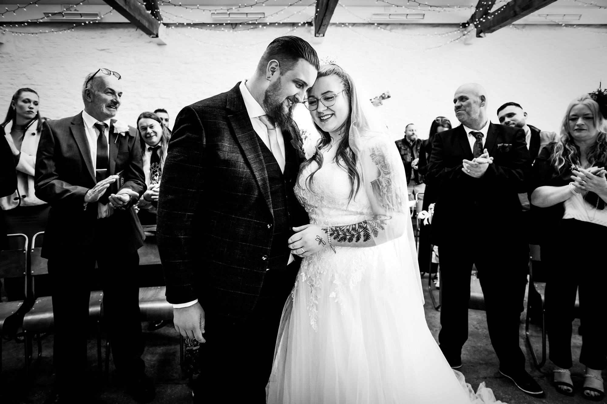 Nat and Jon smile together after their first kiss during the ceremony.