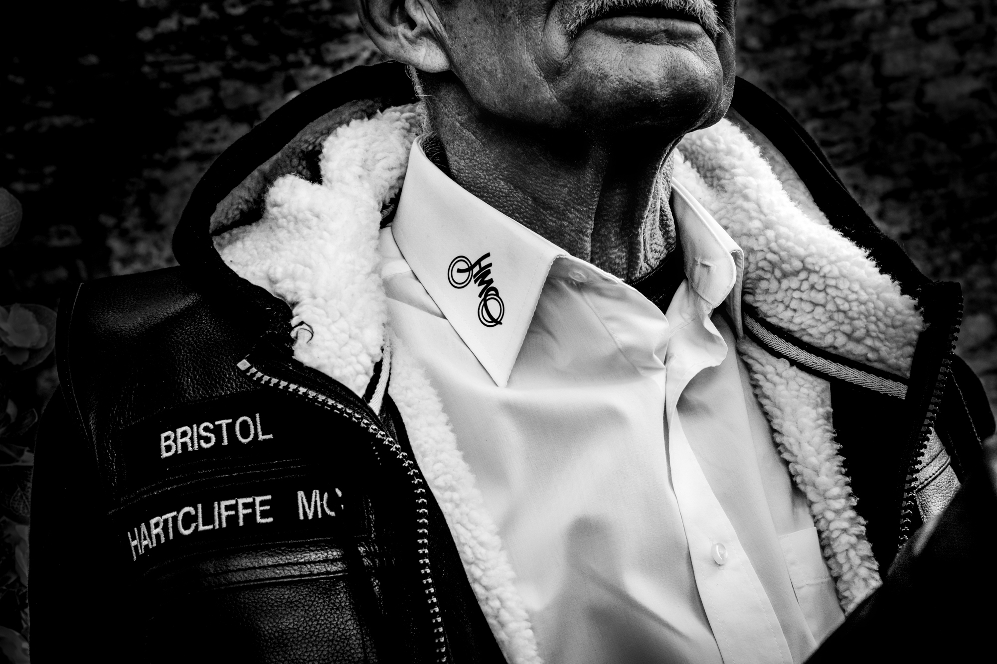 Close-up of a Hartcliffe MC Bristol leather jacket and embroidered collar detail.