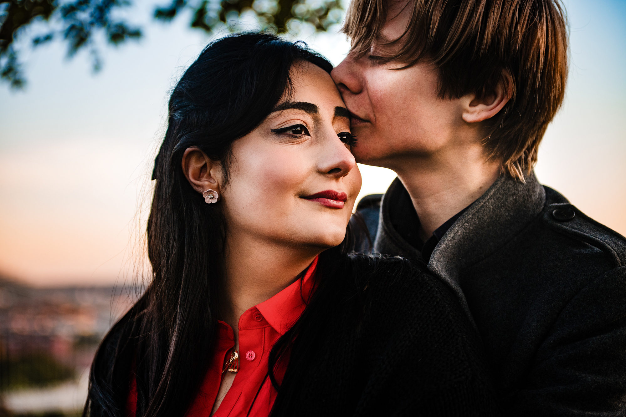 Close-up portrait of forehead kiss during sunset couple session in Clifton.