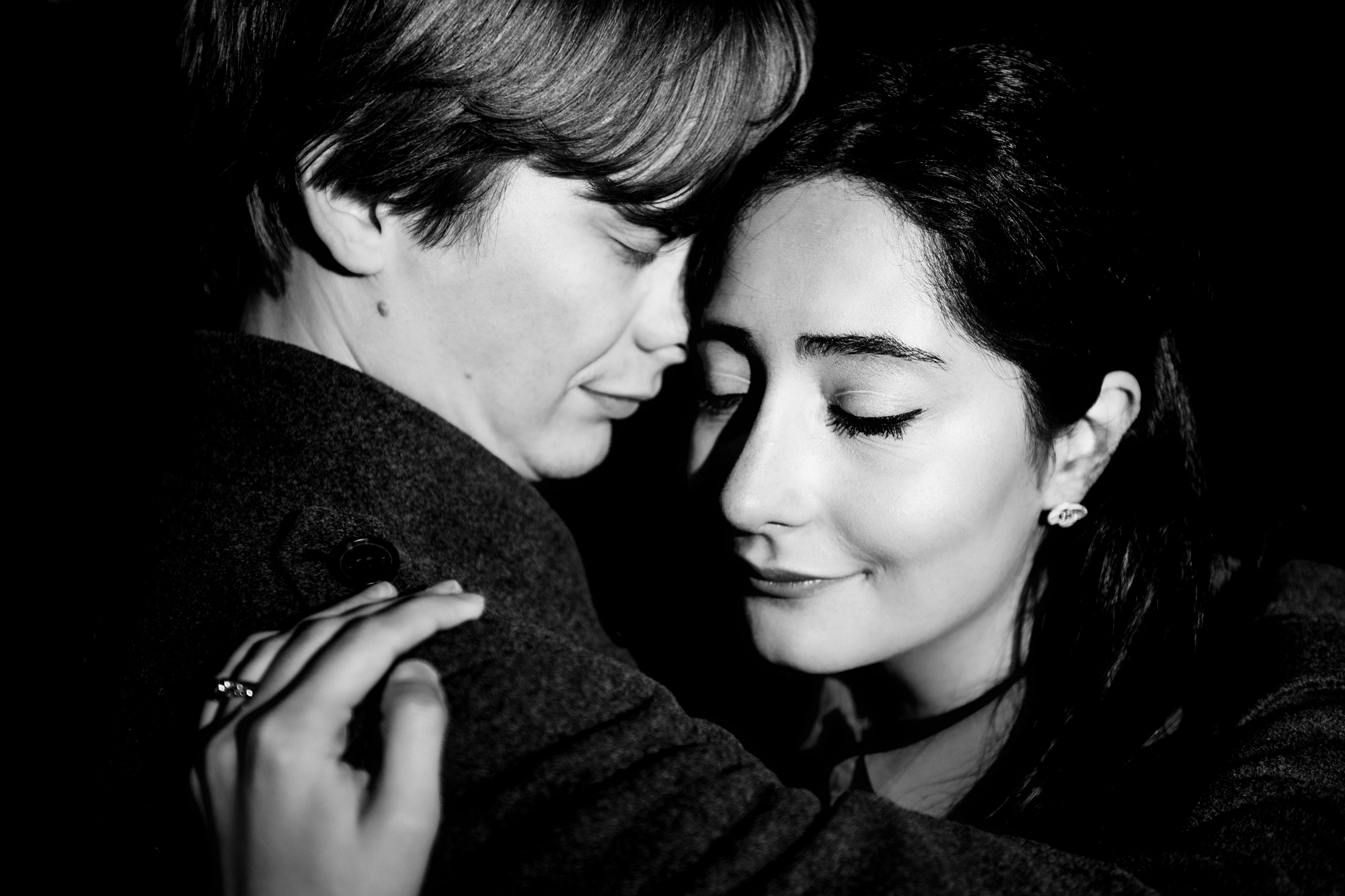 Black and white close-up of couple hugging during romantic Clifton engagement session.