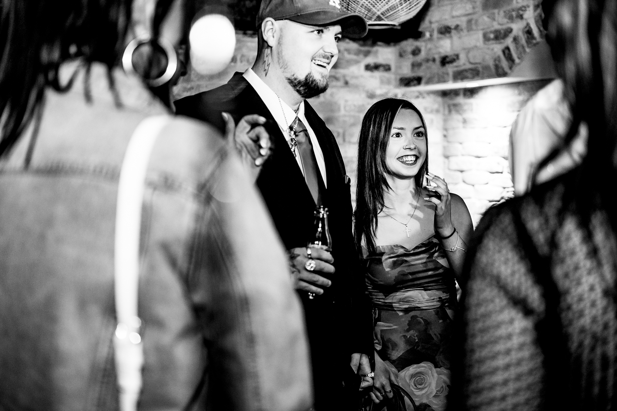 Couple laughing together among guests during their reception-only wedding party at Racks Bristol.