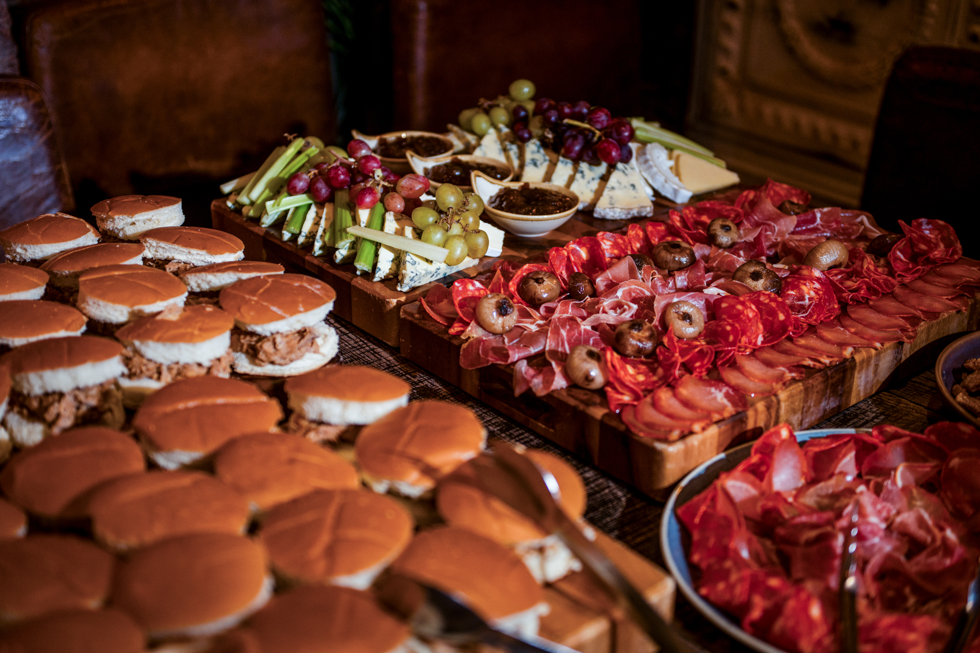 Sliders, cheeses, grapes, and cured meats laid out for guests at Racks Bristol.